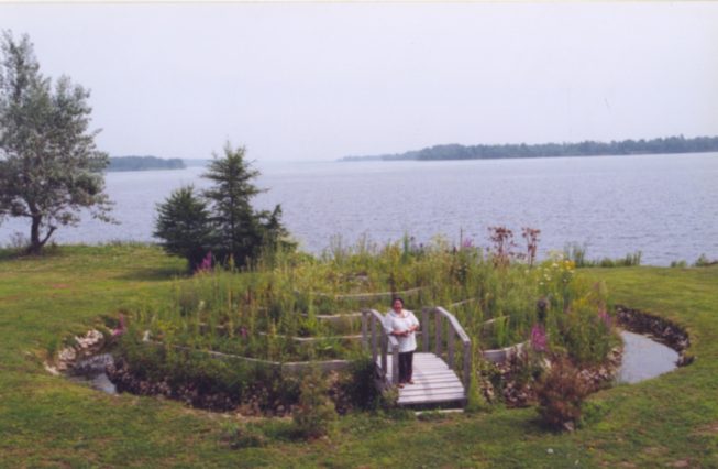 Cecilia Kaienes Mitchell in her medicine wheel garden.