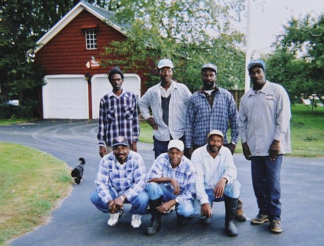 Since the mid-1970s, a community of Jamaican men have joined the workforce each year through the U.S. Department of Labor's H-2A visa program, living and working at the orchard for months at a time. With some participants returning over decades and staying for many months out of the year and some making it a multi-generational practice, with fathers and sons joining the team, this group of men have become part of the Forrence family, and their skills, experience, and dedication are essential to the vitality of the family business. Forrence Orchards, Peru, NY, date and photographer unknown.