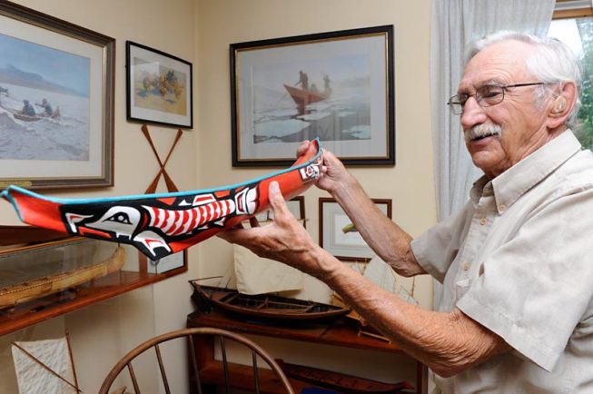 Frank White shows one of his model boats, 2012.