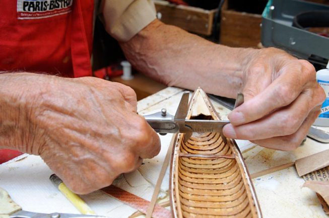 Model wooden boat builder Frank White at work, 2012.