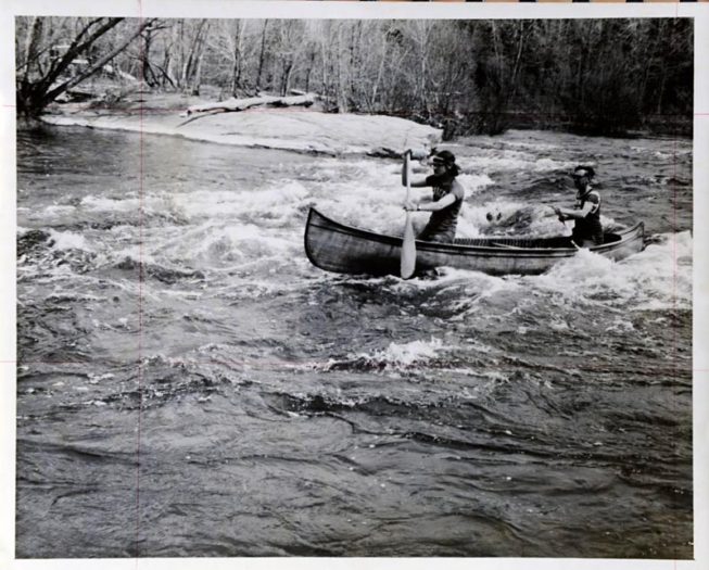 Frank and son Gary White paddling a 60-year-old canoe in the Rushton Canoe Race in May, 1971. Photo by Dwight Church, 1971.