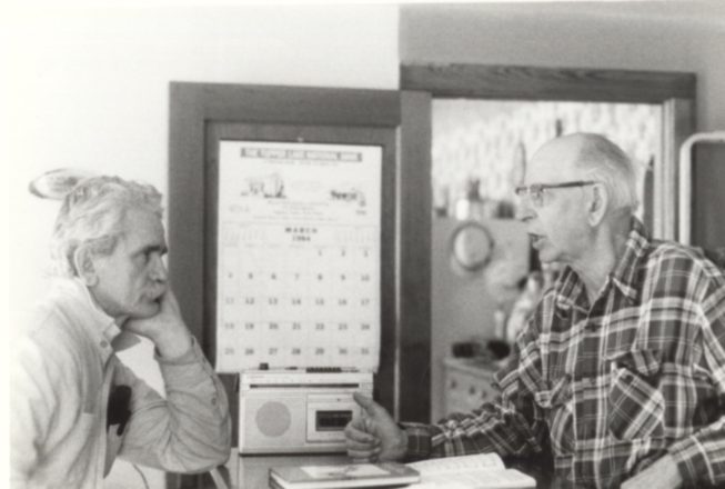 Ham Ferry (right) talks with friend Bill Smith (left), who learned a great deal from him and has become renowned in the region himself (and a fellow TAUNY North Country Living Traditions Award recipient) as a storyteller, musician, and basket maker. Date and photographer unknown.