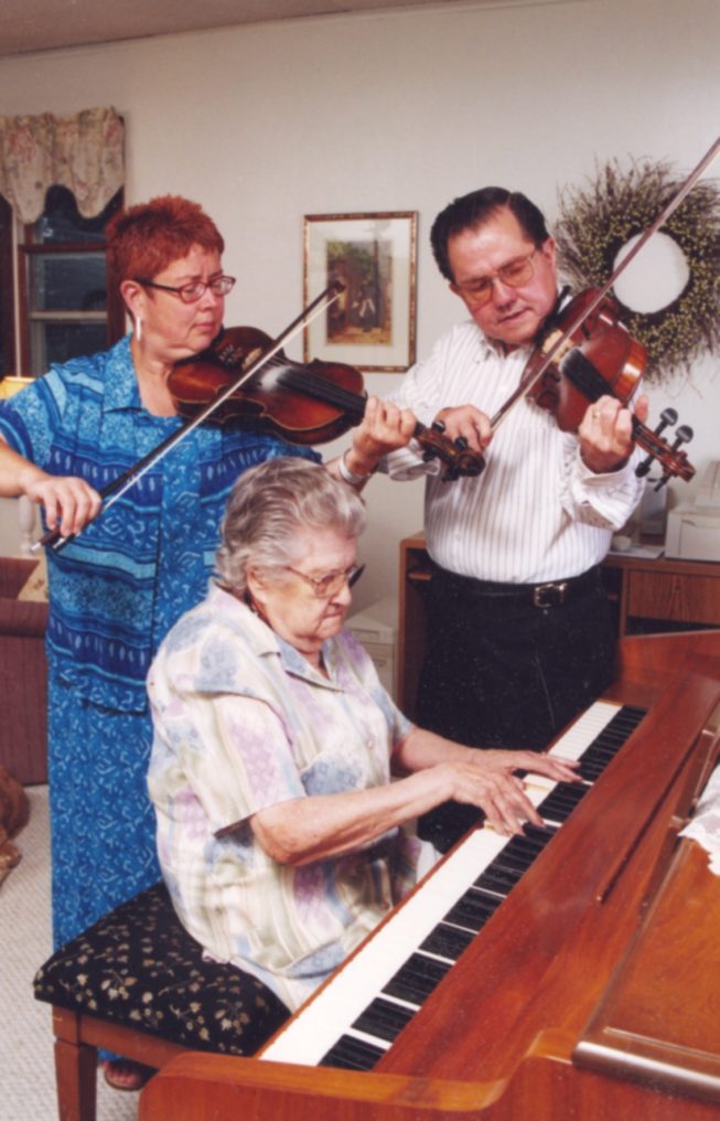 Phyllis Ezero, mother Lois Lawrence Perkins, and brother Don Perkins (l. to r.) of the Perkins Family Band, Champlain Valley dance musicians, 2002.