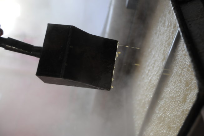 The sap moves through a maze of evaporator chambers as it boils down into the proper consistency for syrup, and the Yanceys keep an eye on it, testing its viscosity throughout the process, 2010.