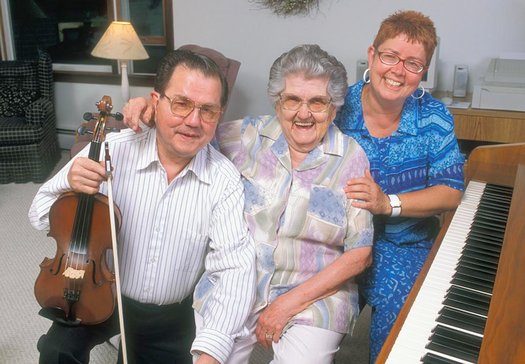 Don Perkins, mother Lois Lawrence Perkins, and sister Phyllis Ezero (l. to r.) of the Perkins Family Band, Champlain Valley dance musicians, 2002.