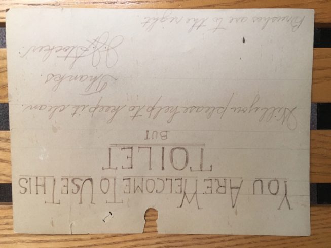 When setting up his business's office on the Arcade balcony, Rod Castillo found this old sign, made by John Stocker for the restroom that used to be open to the public and was accessible through his own long-running and popular office supply store in the Arcade. The sign is written on the back of an ad for duplicating equipment that J. J. Stocker Co., Inc. had available for sale. J.J. Stocker Co. started in 1922 and is still in business (as of 2020), but has relocated out of the Paddock Arcade. Courtesy of Rod Castillo, Keyes Information Technology, 2017.